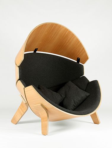 cool designer chair, wooden with black cushions