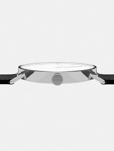 side view of a silver watch face